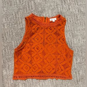 Orange Lace, crop top w/ a zipper in the back.